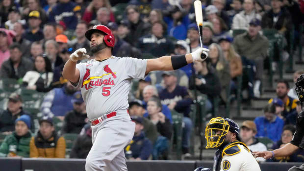 St. Louis Cardinals first baseman Albert Pujols (5) watches his 3-run home run as Milwaukee Brewers catcher Omar Narvaez (10) looks on during the third inning of their game at American Family Field in Milwaukee on Sunday, April 17, 2022.