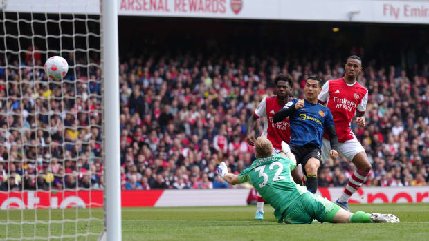Cristiano Ronaldo pictured scoring his 100th Premier League goal for Manchester United at Arsenal's Emirates Stadium in April 2022