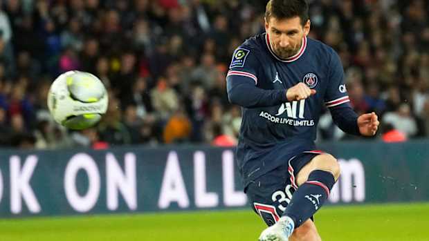 PSG’s Lionel Messi shots a free kick during the French League One soccer match between Paris Saint Germain and Lens at Parc des Princes stadium in Paris, Saturday, April 23, 2022. (AP Photo/Michel Euler)