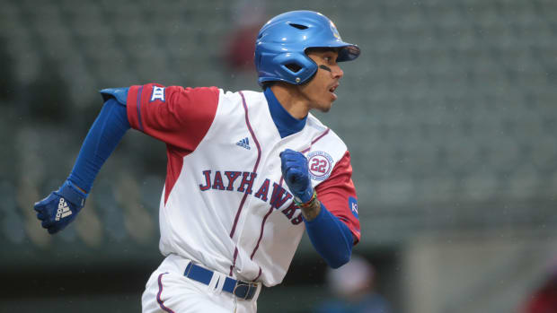Kansas sophomore infielder Maui Ahuna (17) runs to first to score an RBI against Texas Southern in the fifth inning of Tuesday's inaugural Buck O'Neil Classic at Legends Field.