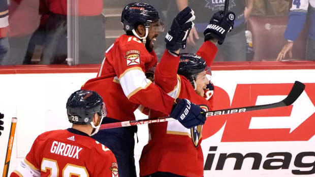 Florida Panthers left wing Anthony Duclair, left, celebrates with defenseman Brandon Montour, right, after Montour scored against the Toronto Maple Leafs in overtime of an NHL hockey game Saturday, April 23, 2022, in Sunrise, Fla. The Panthers won 3-2. (AP Photo/Lynne Sladky)