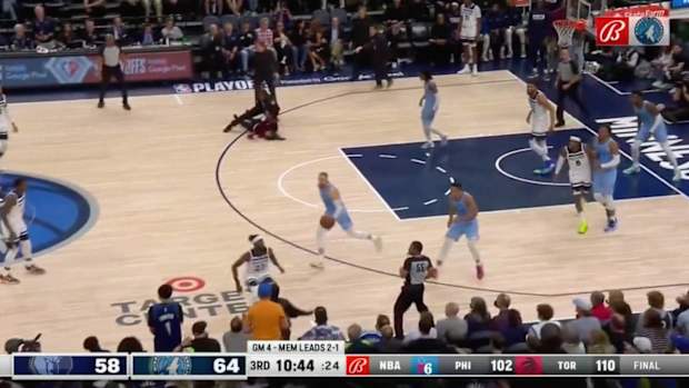 Security tackles protestor during Grizzlies-Timberwolves game in Memphis (Apr. 23, 2022)