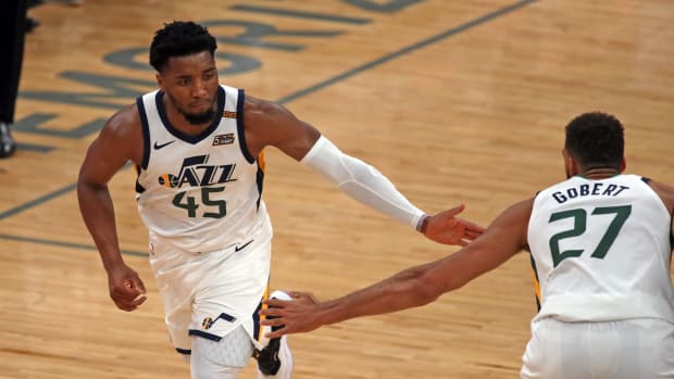 Utah Jazz guard Donovan Mitchell (45) and center Rudy Gobert (27) high five during the second quarter during game four in the first round of the 2021 NBA Playoffs against the Memphis Grizzlies at FedExForum.