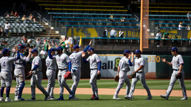 Apr 23, 2022; Oakland, California, USA; Texas Rangers players celebrate their 2-0 victory over the Oakland Athletics at RingCentral Coliseum. Mandatory Credit: D. Ross Cameron-USA TODAY Sports