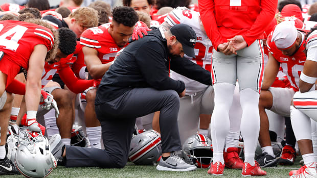 Ohio State coach Ryan Day has a moment of silence for Dwayne Haskins during the Annual Scarlett and Gray Spring game at Ohio Stadium.