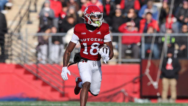 Nov 27, 2021; Piscataway, New Jersey, USA; Rutgers Scarlet Knights wide receiver Bo Melton (18) gains yards after the catch against the Maryland Terrapins during the first half at SHI Stadium. Mandatory Credit: Vincent Carchietta-USA TODAY Sports