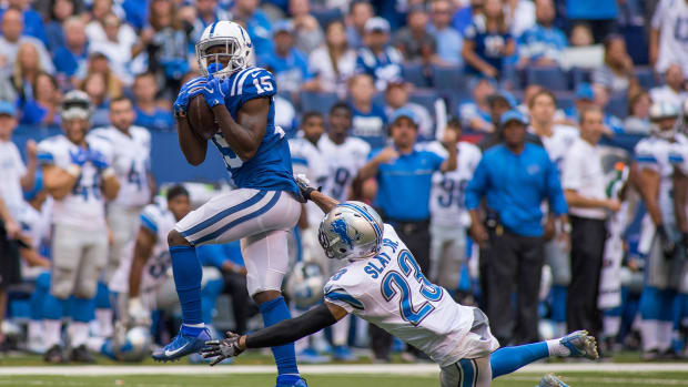 Sep 11, 2016; Indianapolis, IN, USA; Indianapolis Colts wide receiver Phillip Dorsett (15) catches a pass while Detroit Lions cornerback Darius Slay (23) defends in the second half of the game at Lucas Oil Stadium. the Detroit Lions beat the Indianapolis Colts by the score of 39-35.