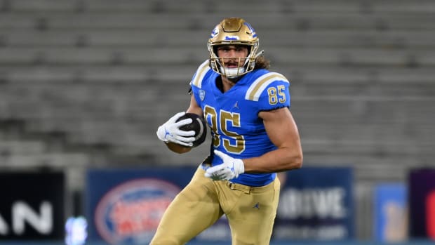 Nov 13, 2021; Pasadena, California, USA; UCLA Bruins tight end Greg Dulcich (85) runs with the ball for a first down in the first half against the Colorado Buffaloes at Rose Bowl. Mandatory Credit: Jayne Kamin-Oncea-USA TODAY Sports