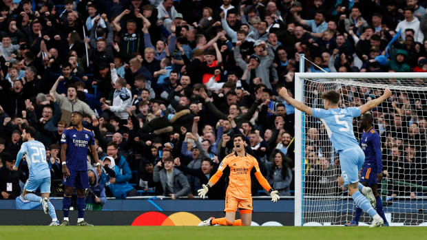 Man City celebrates a goal vs Real Madrid