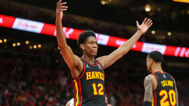Atlanta Hawks forward De'Andre Hunter (12) reacts after being called for a foul against the Miami Heat in the second quarter during game four of the first round of the 2022 NBA playoffs at State Farm Arena.
