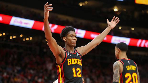 Atlanta Hawks forward De'Andre Hunter (12) reacts after being called for a foul against the Miami Heat in the second quarter during game four of the first round of the 2022 NBA playoffs at State Farm Arena.