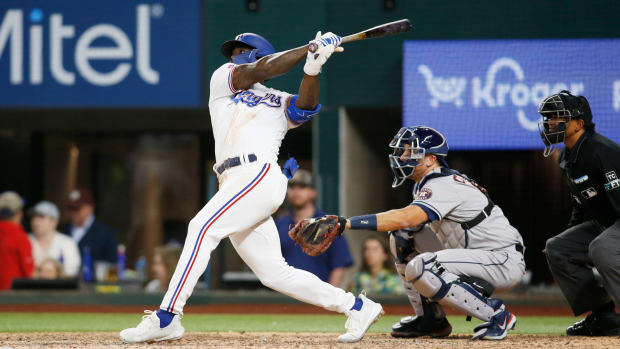 Apr 25, 2022; Arlington, Texas, USA; Texas Rangers right fielder Adolis Garcia (53) hits a double to drive in three runs in the eighth inning against the Houston Astros at Globe Life Field. Mandatory Credit: Tim Heitman-USA TODAY Sports