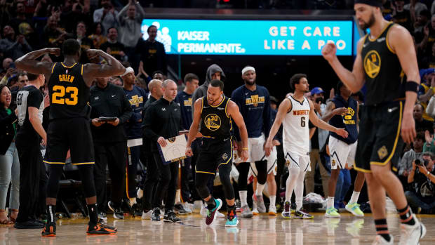 Apr 27, 2022; San Francisco, California, USA; Golden State Warriors guard Stephen Curry (30) reacts after making a layup against the Denver Nuggets in the fourth quarter during game five of the first round for the 2022 NBA playoffs at Chase Center. Mandatory Credit: Cary Edmondson-USA TODAY Sports