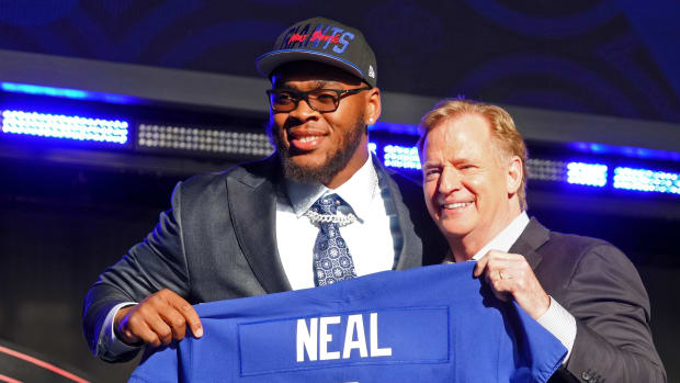 Apr 28, 2022; Las Vegas, NV, USA; Alabama offensive tackle Evan Neal with NFL commissioner Roger Goodell after being selected as the seventh overall pick to the New York Giants during the first round of the 2022 NFL Draft at the NFL Draft Theater.