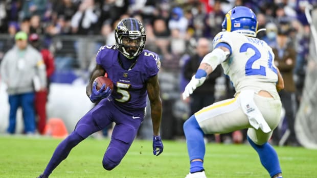Jan 2, 2022; Baltimore, Maryland, USA; Baltimore Ravens wide receiver Marquise Brown (5) runs as Los Angeles Rams free safety Taylor Rapp (24) defends during the second half at M&T Bank Stadium.