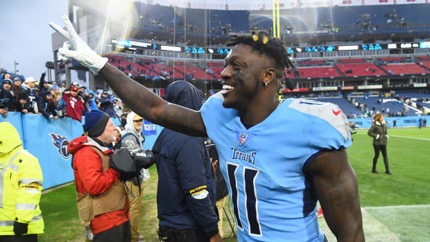 Titans wide receiver A.J. Brown (11) celebrates after a win against the Dolphins.