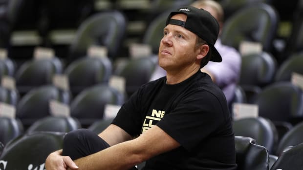 Utah Jazz owner Ryan Smith watches his team warm up pro to their game against the LA Clippers at Vivint Arena.
