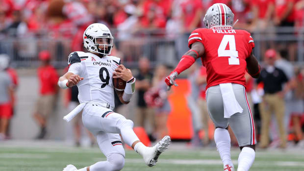 Cincinnati Bearcats quarterback Desmond Ridder (9) slides for a first down in the first quarter of a college football game against the Ohio State Buckeyes, Saturday, Sept. 7, 2019, at Ohio Stadium in Columbus. Cincinnati Bearcats At Ohio State Buckeyes Sept 7