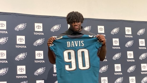 Jordan Davis displays his jersey after being picked 13th overall in the 2022 NFL Draft
