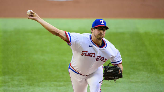 Apr 30, 2022; Arlington, Texas, USA; Texas Rangers starting pitcher Dane Dunning (33) pitches against the Atlanta Braves during the first inning at Globe Life Field. Mandatory Credit: Jerome Miron-USA TODAY Sports