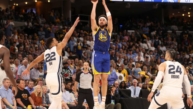 May 1, 2022; Memphis, Tennessee, USA; Golden State Warriors guard Klay Thompson (11) shoots the ball against the Memphis Grizzlies during game one of the second round for the 2022 NBA playoffs at FedExForum. Mandatory Credit: Joe Rondone-USA TODAY Sports