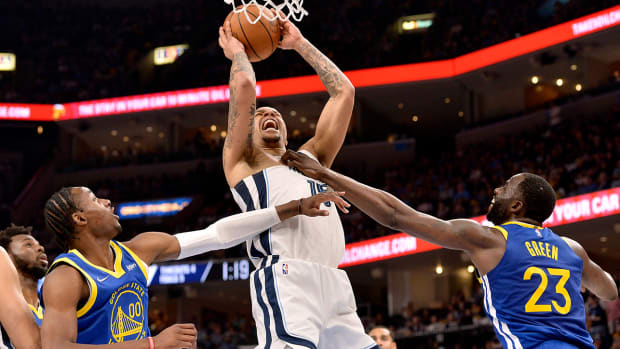Warriors forward Draymond Green (23) fouls Grizzlies forward Brandon Clarke (15), resulting in Green being ejected, in the first half during Game 1 of a second-round NBA basketball playoff series.