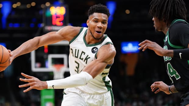 Milwaukee Bucks forward Giannis Antetokounmpo (34) passes the ball against Boston Celtics center Robert Williams III (44) in the second half during game one of the second round