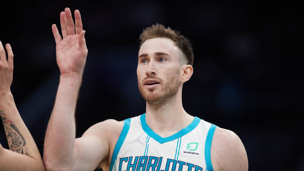 Charlotte Hornets forward Gordon Hayward (20) high fives a teammate during second half action against the Detroit Pistons at Spectrum Center.