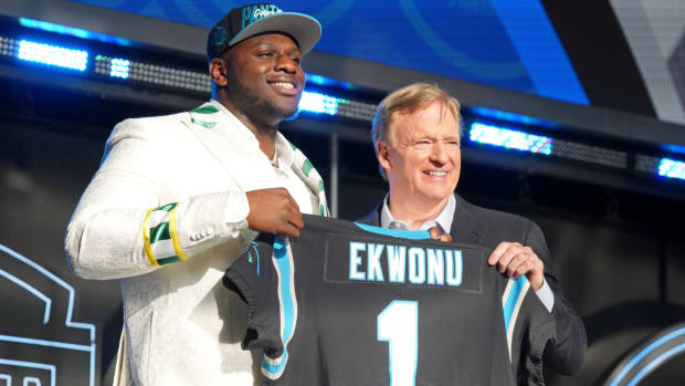 Apr 28, 2022; Las Vegas, NV, USA; North Carolina State offensive tackle Ikem Ekwonu with NFL commissioner Roger Goodell after being selected as the sixth overall pick to the Carolina Panthers during the first round of the 2022 NFL Draft at the NFL Draft Theater.
