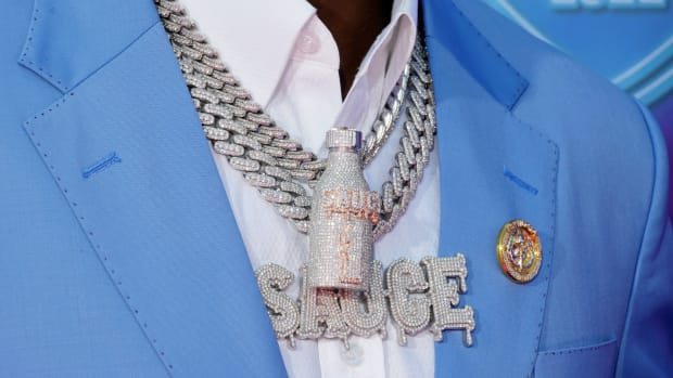 Apr 28, 2022; Las Vegas, NV, USA; A detail view of a necklace and pins worn by Cincinnati cornerback Ahmad Sauce Gardner on the red carpet at the Fountains of Bellagio before the first round of the 2022 NFL Draft. Mandatory Credit: Kirby Lee-USA TODAY Sports
