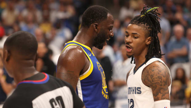 Golden State Warriors forward Draymond Green (23) and Memphis Grizzlies guard Ja Morant (12) have words during Game 1 of the second round for the 2022 NBA playoffs at FedExForum.