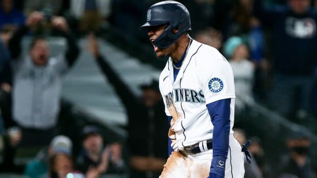 Apr 23, 2022; Seattle, Washington, USA; Seattle Mariners center fielder Julio Rodriguez (44) reacts after sliding home safely to score during the seventh inning against the Kansas City Royals at T-Mobile Park.