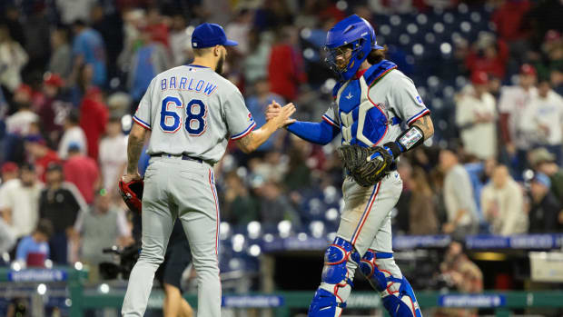 May 3, 2022; Philadelphia, Pennsylvania, USA; Texas Rangers relief pitcher Joe Barlow (68) and catcher Jonah Heim (28) shake hands after a victory against the Philadelphia Phillies at Citizens Bank Park. Mandatory Credit: Bill Streicher-USA TODAY Sports