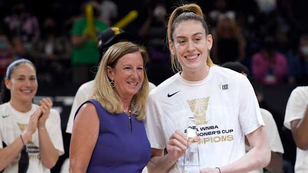 NBA commissioner Cathy Engelbert and Seattle Storm forward Breanna Stewart (30) pose with the MVP trophy.
