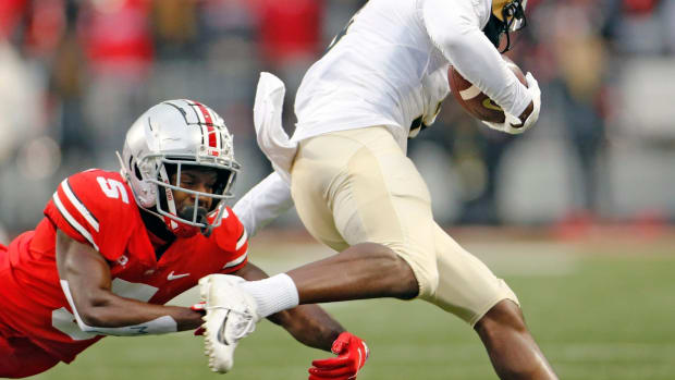 Ohio State Buckeyes cornerback Marcus Williamson (5) can't come up with the tackle of Purdue Boilermakers wide receiver David Bell (3) after a catch during the 1st quarter of their NCAA game at Ohio Stadium in Columbus, Ohio on November 13, 2021. Osu21pur Kwr 08