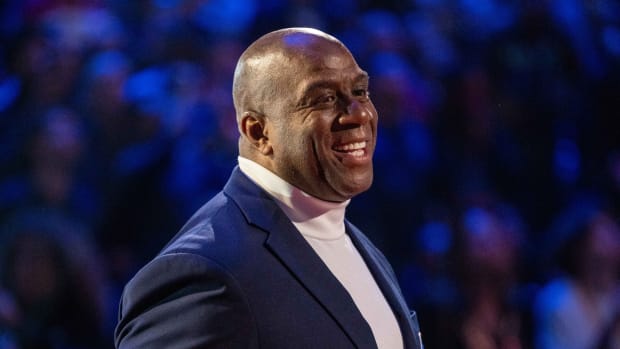 NBA great Magic Johnson is honored for being selected to the NBA 75th Anniversary Team during halftime in the 2022 NBA All-Star Game at Rocket Mortgage FieldHouse.