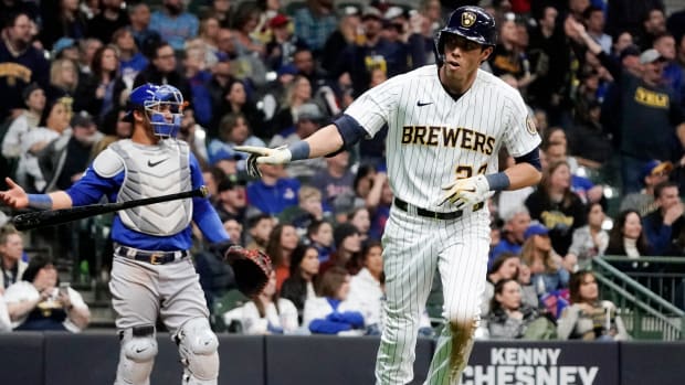 Milwaukee Brewers’ Christian Yelich hits a two-run home run during the fifth inning of a baseball game against the Chicago Cubs Friday, April 29, 2022, in Milwaukee.