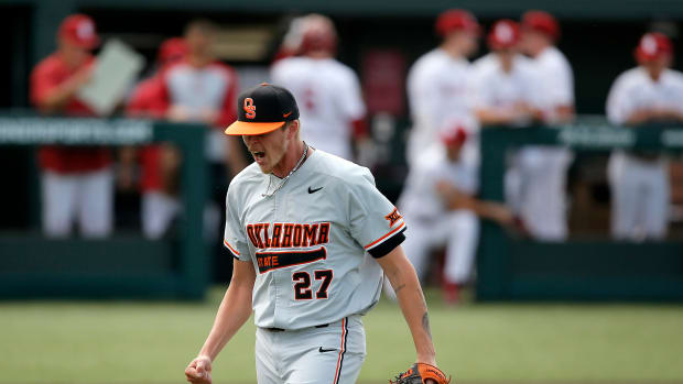 Oklahoma State's Justin Campbell (27) celebrates after getting the final out of the fifth inning on May 1 at OU. cover