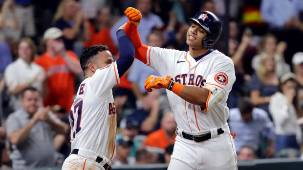 Houston Astros’ Jose Altuve, left, and Jeremy Pena celebrate Pena’s home run against the Detroit Tigers during the fifth inning of a baseball game Thursday, May 5, 2022, in Houston.