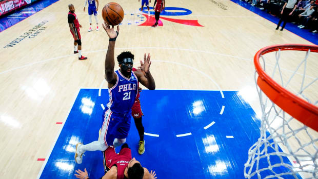 Philadelphia 76ers’ Joel Embiid goes up for a shot against Miami Heat’s Max Strus during the first half of Game 3 of an NBA basketball second-round playoff series, Friday, May 6, 2022, in Philadelphia.