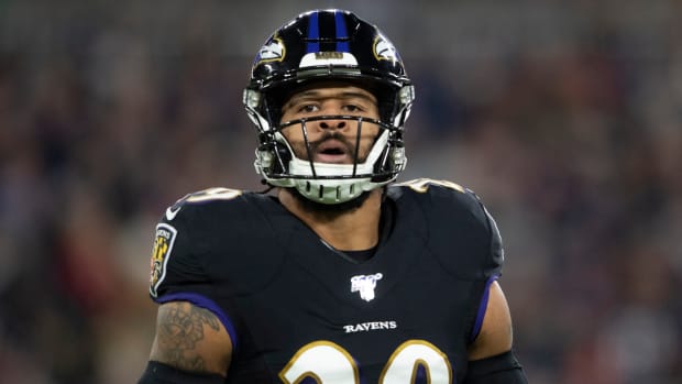 Former Ravens safety Earl Thomas looks on during a game.