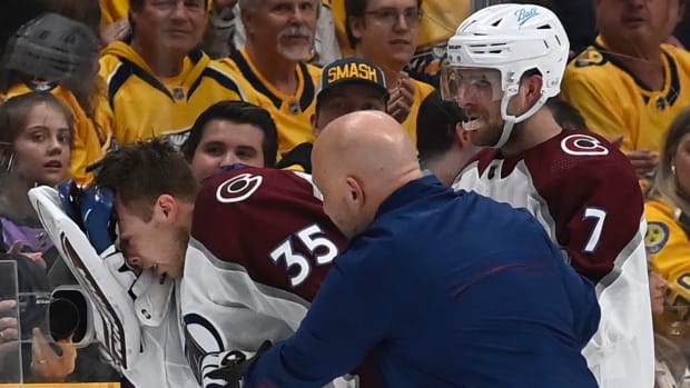 Colorado Avalanche goaltender Darcy Kuemper (35) is helped off the ice after getting injured during the first period in Game 3 of an NHL hockey Stanley Cup first-round playoff series against the Nashville Predators Saturday, May 7, 2022, in Nashville, Tenn.