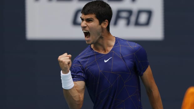 Carlos Alcaraz celebrates winning a point