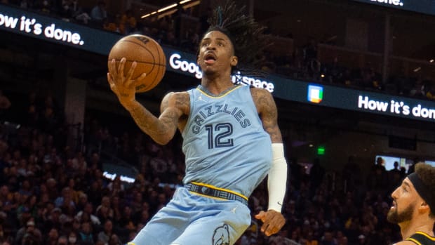 Memphis Grizzlies guard Ja Morant (12) drives to the basket against Golden State Warriors guard Klay Thompson.