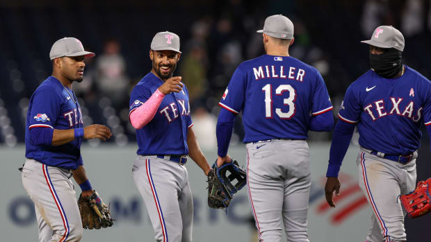 May 8, 2022; Bronx, New York, USA; Texas Rangers second baseman Marcus Semien (2) celebrates with second baseman Brad Miller (13) after the game against the New York Yankees at Yankee Stadium.
