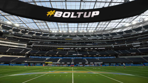 Dec 12, 2021; Inglewood, California, USA; A detailed view of the Los Angeles Chargers logo at the 50-yard line and Oculus video board at SoFi Stadium. Mandatory Credit: Kirby Lee-USA TODAY Sports