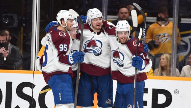 Colorado Avalanche players celebrate after a goal