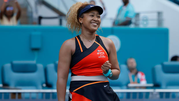 Naomi Osaka celebrates match point.