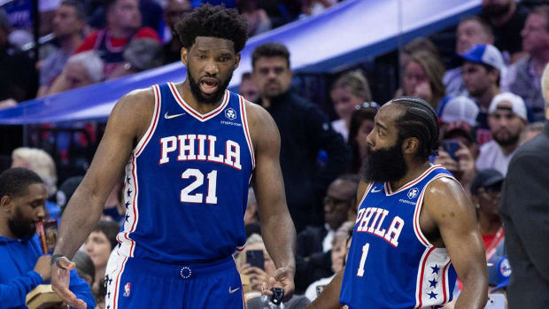 May 12, 2022; Philadelphia, Pennsylvania, USA; Philadelphia 76ers center Joel Embiid (21) and guard James Harden (1) talk during the fourth quarter against the Miami Heat in game six of the second round of the 2022 NBA playoffs at Wells Fargo Center.