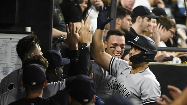 New York Yankees sluggers Aaron Judge, Giancarlo Stanton celebrate in dugout